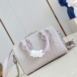 Louis Vuitton-inspired Speedy Bandoulière 20 replica handbag in Monogram Empreinte-style embossed grained leather