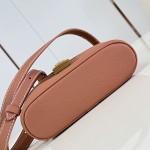 Louis Vuitton-inspired Low Key Vanity Pouch replica handbag in brown and black with brass-style lock