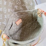 Louis Vuitton Rendez-Vous Sunset denim handbag M27210 with metal hardware buckle detail and interior flat pocket