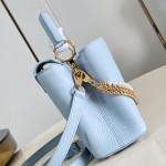 Louis Vuitton Capucines East-West Why Knot Taurillon leather handbag in mini and small sizes with Monogram beaded chain and shiny metal hardware