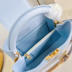 Louis Vuitton Capucines East-West Why Knot Taurillon leather handbag in mini and small sizes with Monogram beaded chain and shiny metal hardware