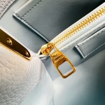 Louis Vuitton Capucines East-West Why Knot Taurillon leather handbag in mini and small sizes with Monogram beaded chain and shiny metal hardware