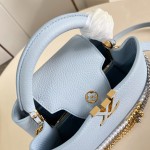 Louis Vuitton Capucines East-West Why Knot Taurillon leather handbag in mini and small sizes with Monogram beaded chain and shiny metal hardware