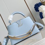 Louis Vuitton Capucines East-West Why Knot Taurillon leather handbag in mini and small sizes with Monogram beaded chain and shiny metal hardware