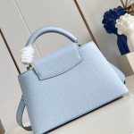 Louis Vuitton Capucines East-West Why Knot Taurillon leather handbag in mini and small sizes with Monogram beaded chain and shiny metal hardware
