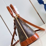 Louis Vuitton Alma BB M53152 Monogram canvas handbag with crocodile-embossed leather trim, Toron handles, padlock, and adjustable shoulder strap