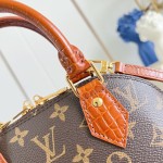 Louis Vuitton Alma BB M53152 Monogram canvas handbag with crocodile-embossed leather trim, Toron handles, padlock, and adjustable shoulder strap