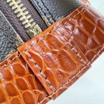 Louis Vuitton Alma BB M53152 Monogram canvas handbag with crocodile-embossed leather trim, Toron handles, padlock, and adjustable shoulder strap