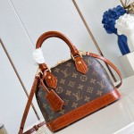 Louis Vuitton Alma BB M53152 Monogram canvas handbag with crocodile-embossed leather trim, Toron handles, padlock, and adjustable shoulder strap