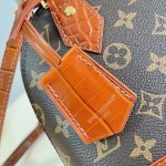Louis Vuitton Alma BB M53152 Monogram canvas handbag with crocodile-embossed leather trim, Toron handles, padlock, and adjustable shoulder strap