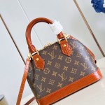 Louis Vuitton Alma BB M53152 Monogram canvas handbag with crocodile-embossed leather trim, Toron handles, padlock, and adjustable shoulder strap