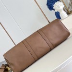 Louis Vuitton Needle M28000 Monogram canvas handbag with leather side bands and top handle