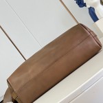 Louis Vuitton Vagabond Hobo M28392 soft tanned leather shoulder bag with an adjustable woven strap, padlock, and LV Blason jacquard lining